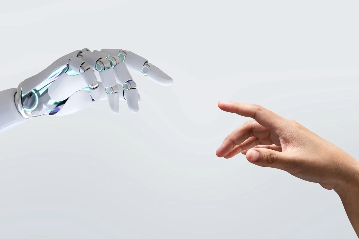 Mano robótica y mano humana acercándose, imagen de tecnología y automatización